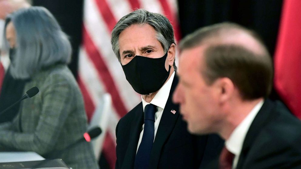 PHOTO: National Security Advisor Jake Sullivan speaks as Secretary of State Antony Blinken looks on, at the opening session of U.S.-China talks at the Captain Cook Hotel in Anchorage, Alaska, March 18, 2021. 